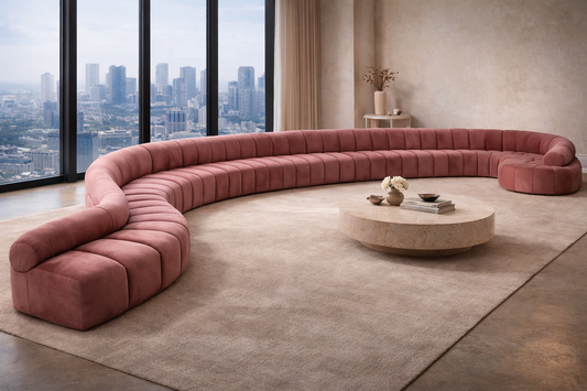 Fancci Serpent curved sectional sofa with extended channel tufted design in a modern luxury penthouse interior.