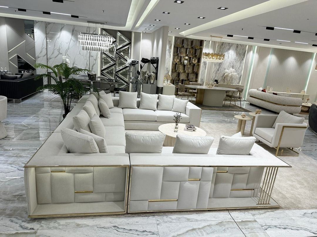 Rhythm luxury furniture collection featuring modular sofa, black dining table, gold detailed sideboard, and geometric modern design.