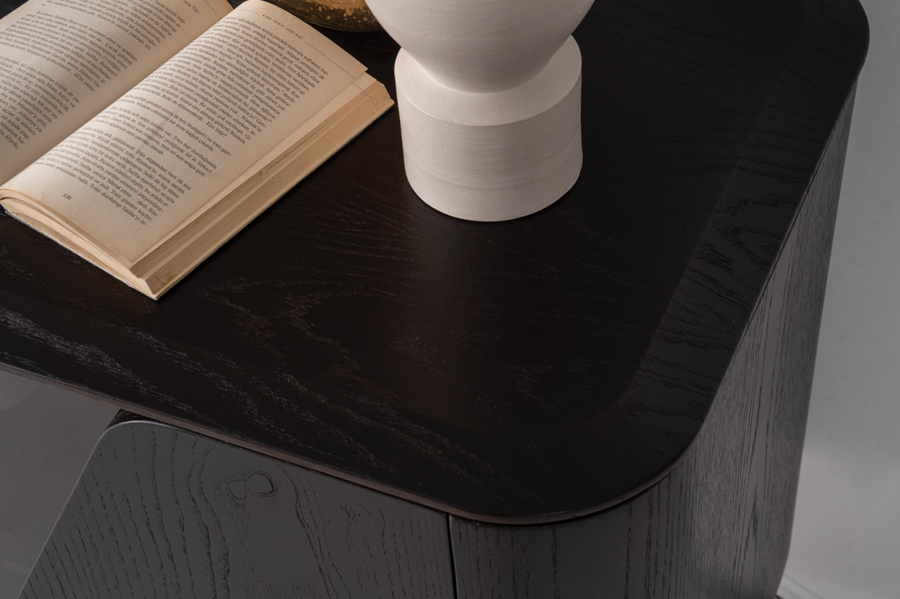 Noirwood luxury furniture collection featuring sculptural dark wood sideboard with ambient lighting and modern abstract mirrors.