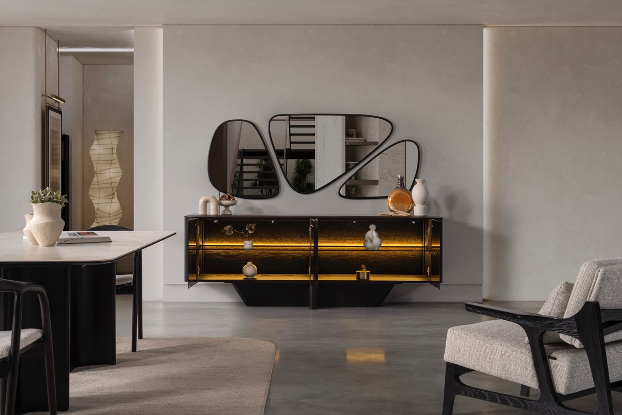 Noirwood luxury furniture collection featuring sculptural dark wood sideboard with ambient lighting and modern abstract mirrors.