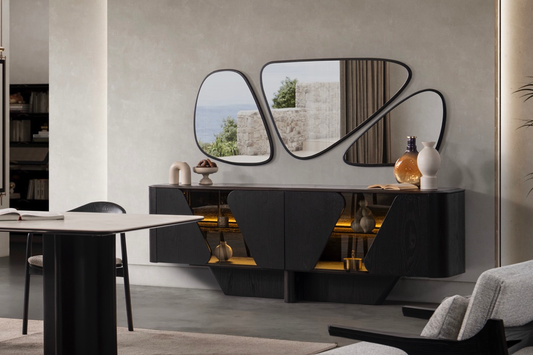 Noirwood luxury furniture collection featuring sculptural dark wood sideboard with ambient lighting and modern abstract mirrors.