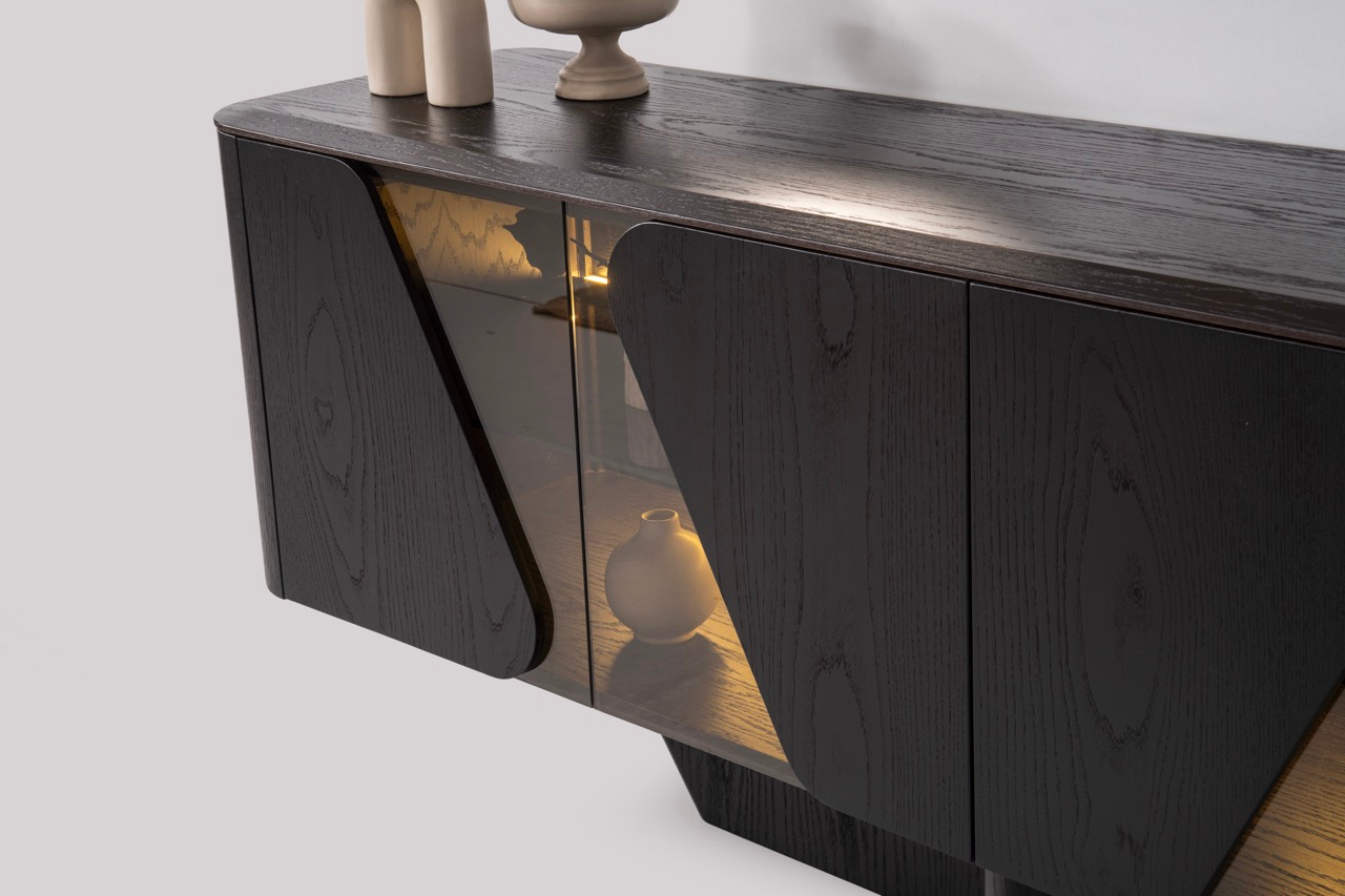 Noirwood luxury furniture collection featuring sculptural dark wood sideboard with ambient lighting and modern abstract mirrors.