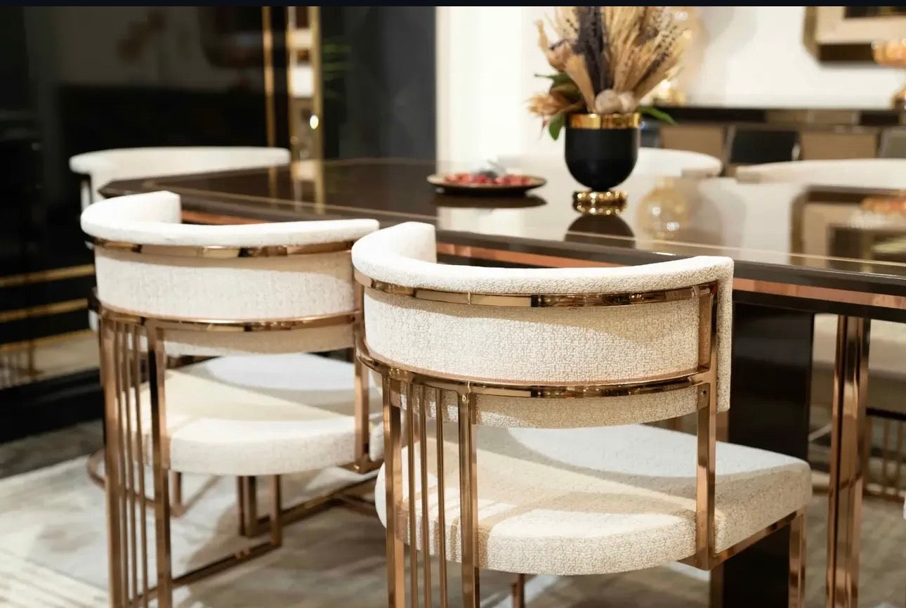 Nocturne luxury furniture collection featuring mirrored sofa detailing, geometric dining table, sculptural chairs, and modern glam interior design.