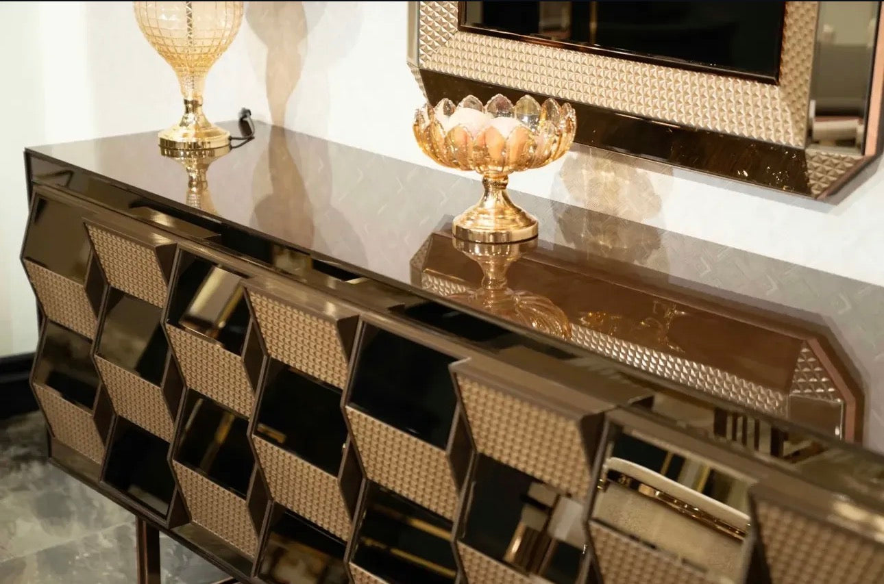 Nocturne luxury furniture collection featuring mirrored sofa detailing, geometric dining table, sculptural chairs, and modern glam interior design.