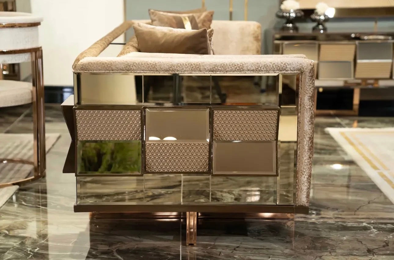 Nocturne luxury furniture collection featuring mirrored sofa detailing, geometric dining table, sculptural chairs, and modern glam interior design.