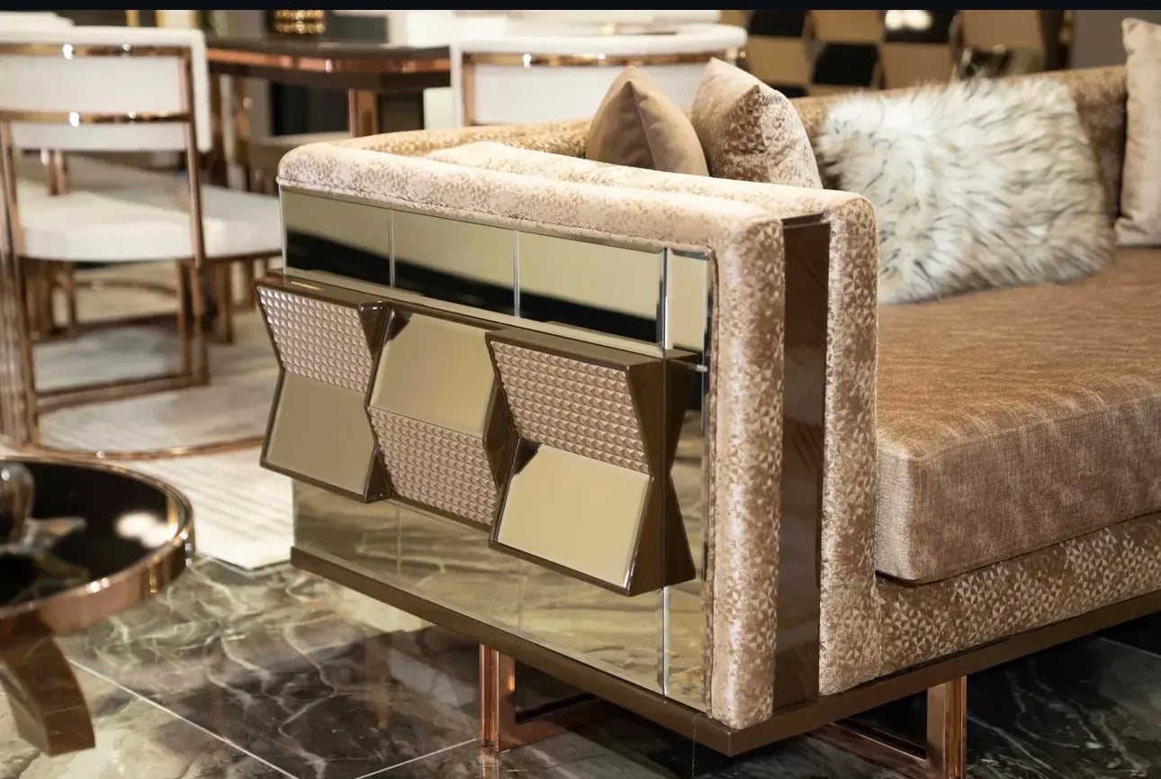 Nocturne luxury furniture collection featuring mirrored sofa detailing, geometric dining table, sculptural chairs, and modern glam interior design.