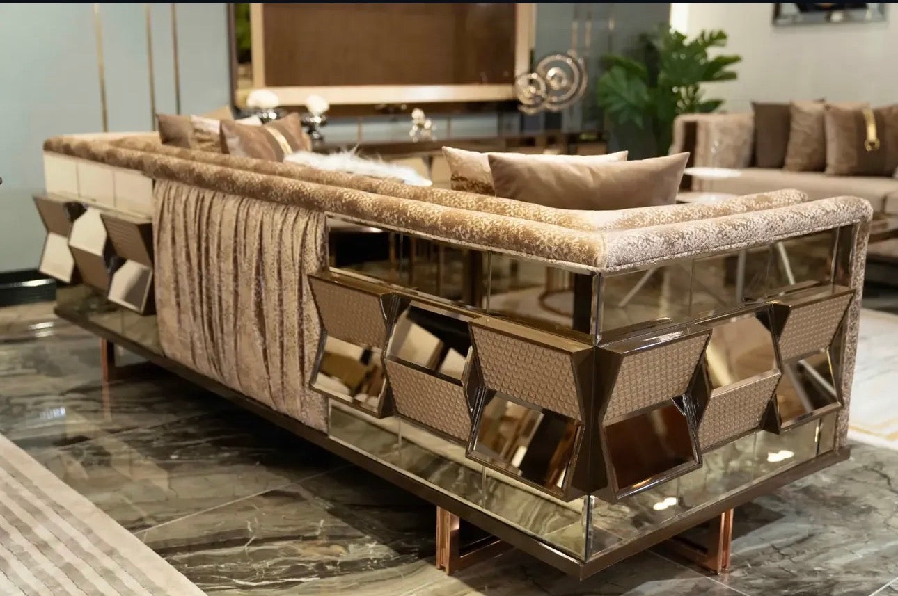 Nocturne luxury furniture collection featuring mirrored sofa detailing, geometric dining table, sculptural chairs, and modern glam interior design.