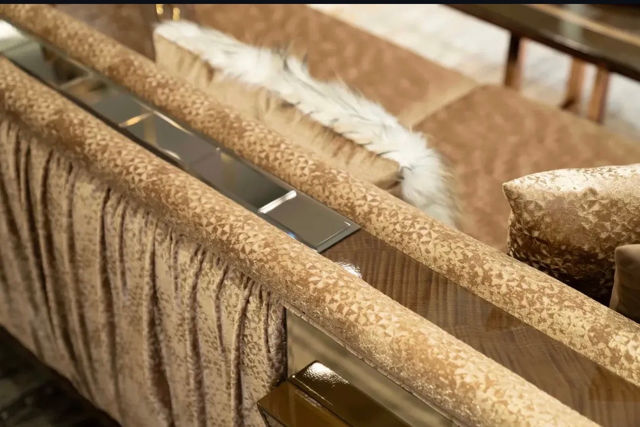 Nocturne luxury furniture collection featuring mirrored sofa detailing, geometric dining table, sculptural chairs, and modern glam interior design.