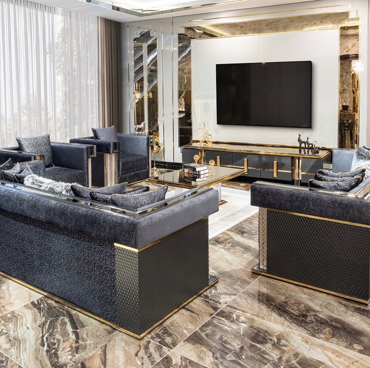 Ember luxury furniture collection with sculptural living room seating, dramatic bedroom set and gold accent dining furniture