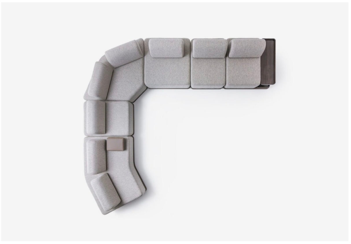 Afterglow modular sectional sofa collection with sculptural coffee tables and modern neutral lounge seating in a contemporary luxury interior.