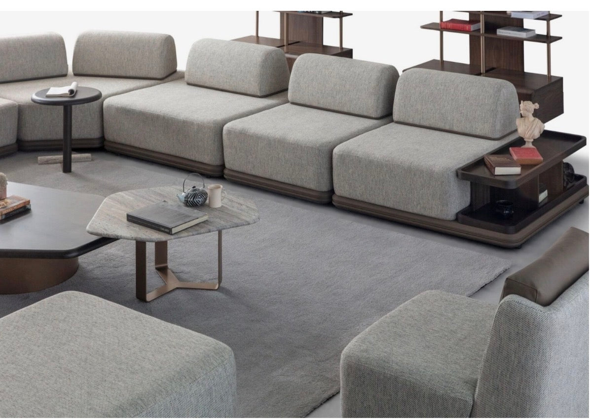 Afterglow modular sectional sofa collection with sculptural coffee tables and modern neutral lounge seating in a contemporary luxury interior.