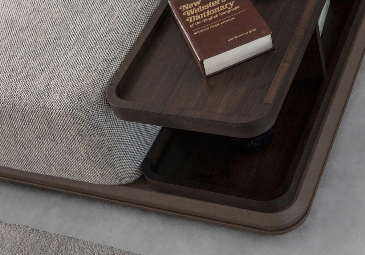 Afterglow modular sectional sofa collection with sculptural coffee tables and modern neutral lounge seating in a contemporary luxury interior.