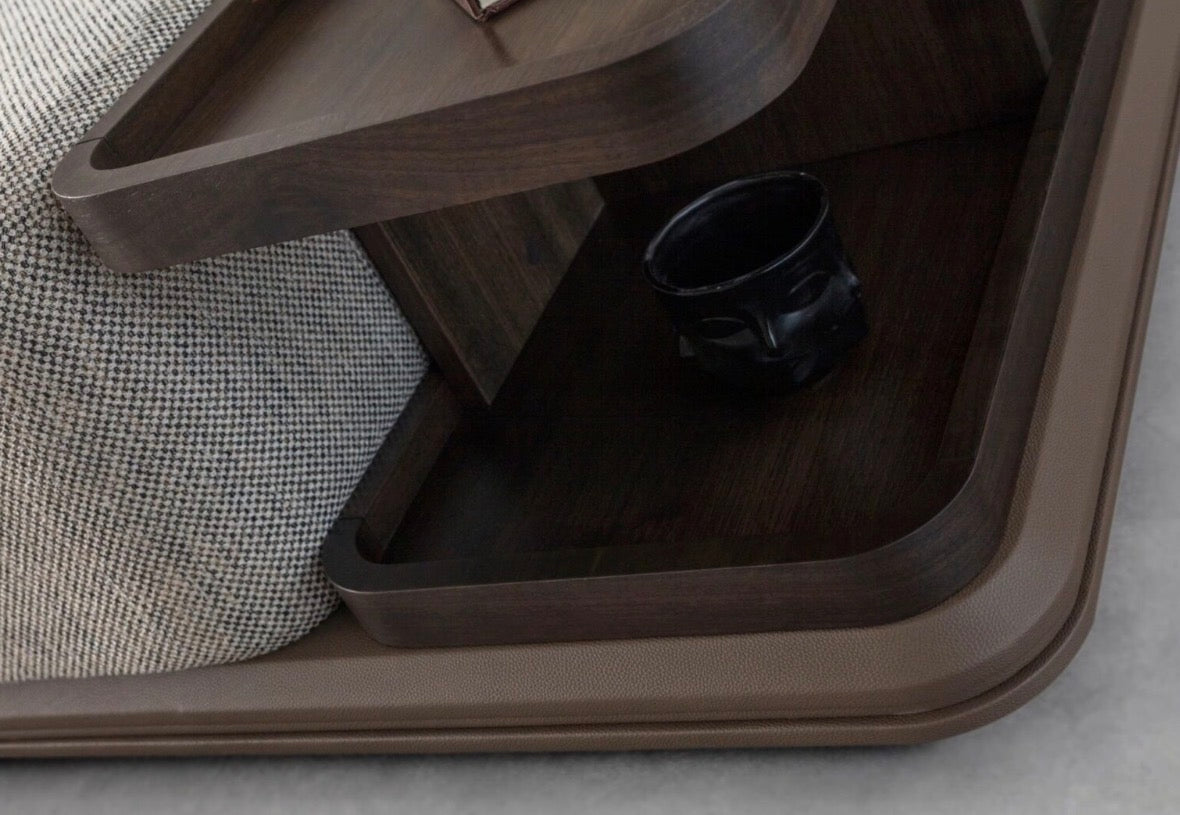 Afterglow modular sectional sofa collection with sculptural coffee tables and modern neutral lounge seating in a contemporary luxury interior.