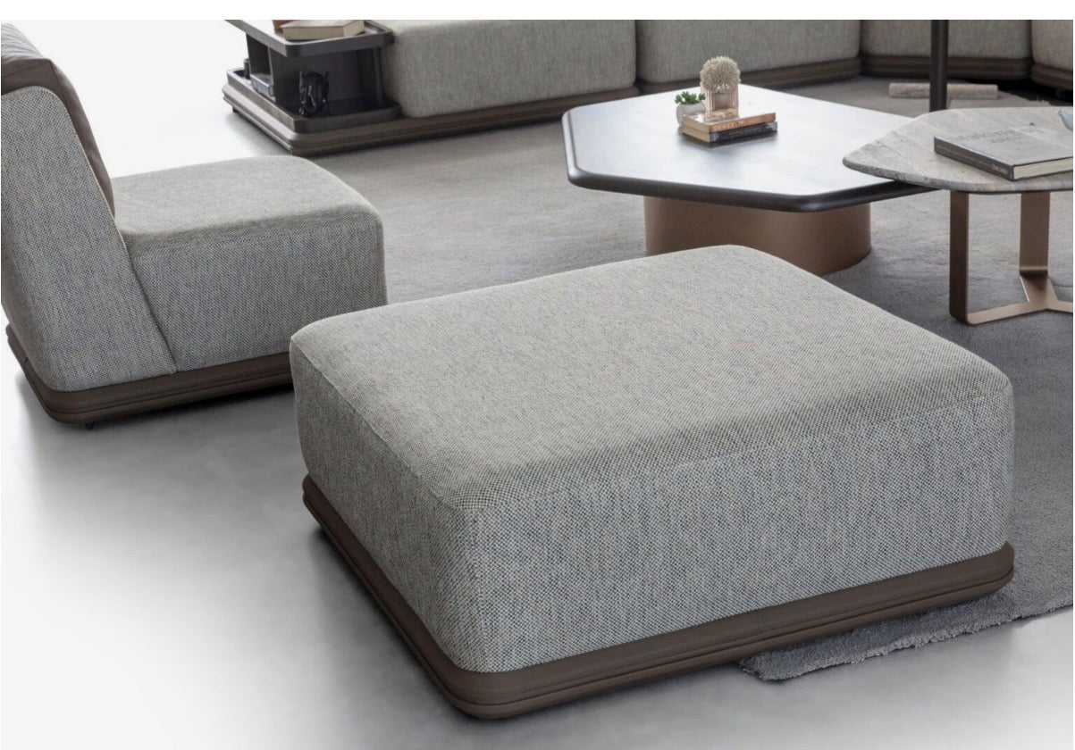 Afterglow modular sectional sofa collection with sculptural coffee tables and modern neutral lounge seating in a contemporary luxury interior.