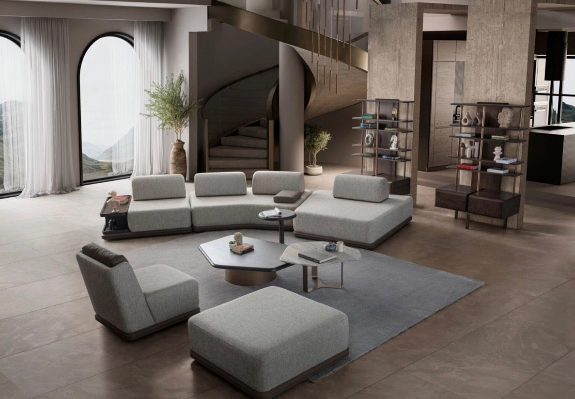 Afterglow modular sectional sofa collection with sculptural coffee tables and modern neutral lounge seating in a contemporary luxury interior.