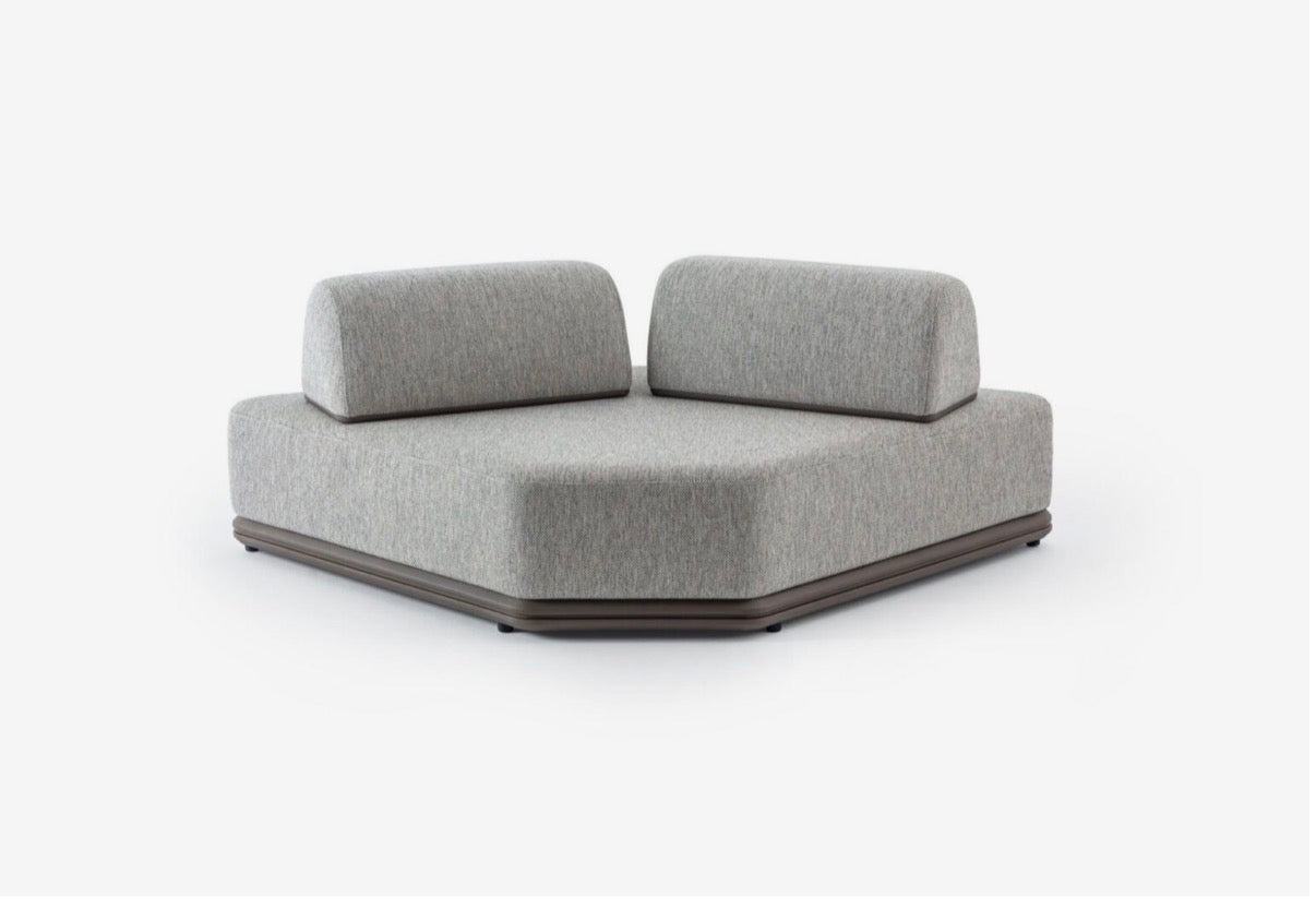 Afterglow modular sectional sofa collection with sculptural coffee tables and modern neutral lounge seating in a contemporary luxury interior.