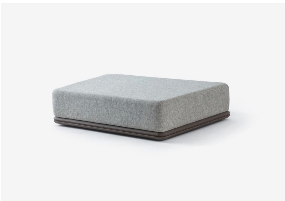 Afterglow modular sectional sofa collection with sculptural coffee tables and modern neutral lounge seating in a contemporary luxury interior.