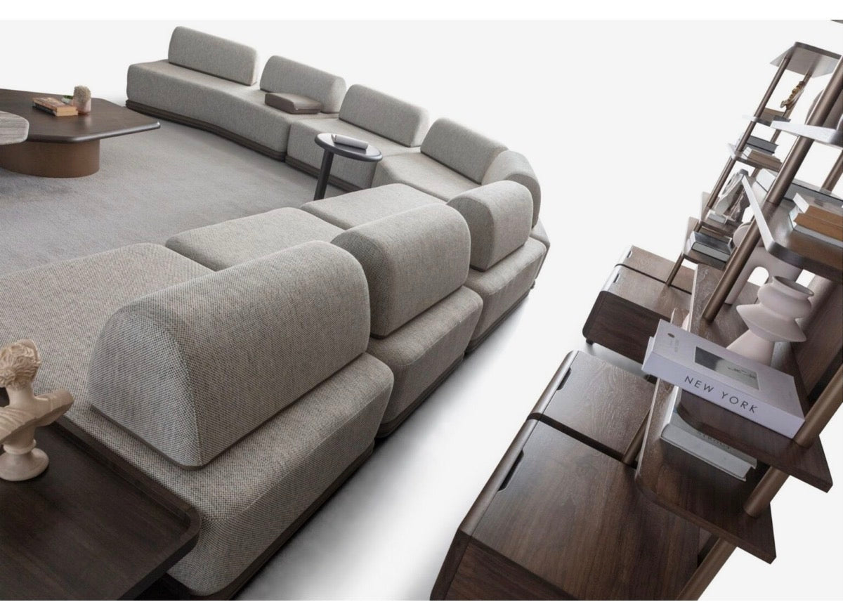 Afterglow modular sectional sofa collection with sculptural coffee tables and modern neutral lounge seating in a contemporary luxury interior.
