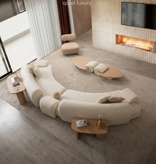 Aureum luxury furniture collection featuring modern neutral living room seating, sculptural dining set, and illuminated contemporary bedroom design.