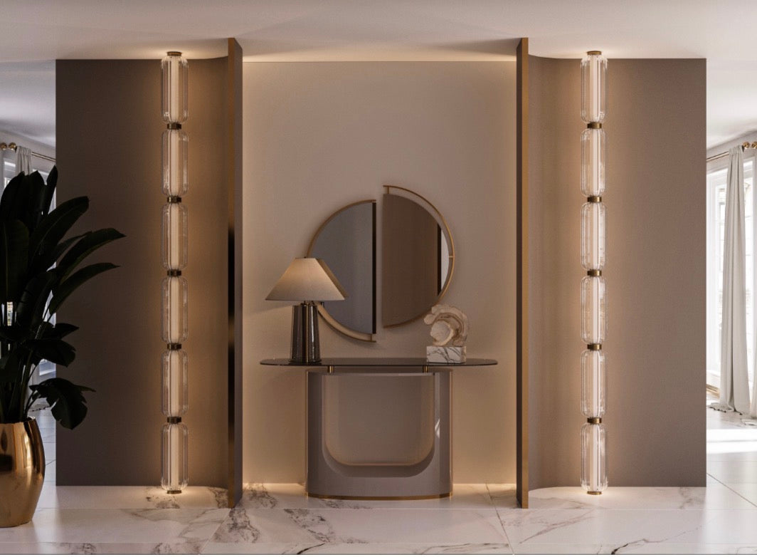 Modern luxury living room and dining set with curved sofas, sculptural chairs, and gold accent tables in neutral interior.