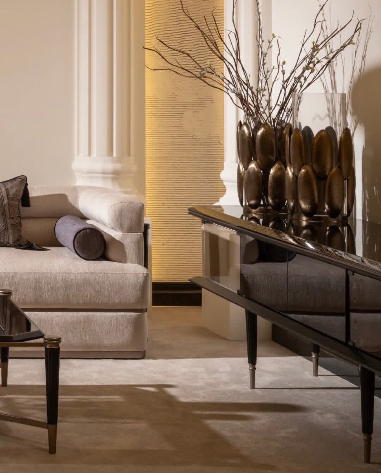 Velvetroom luxury furniture collection featuring elegant sofa seating, modern dining table, illuminated cabinetry, and sculptural pendant lighting.