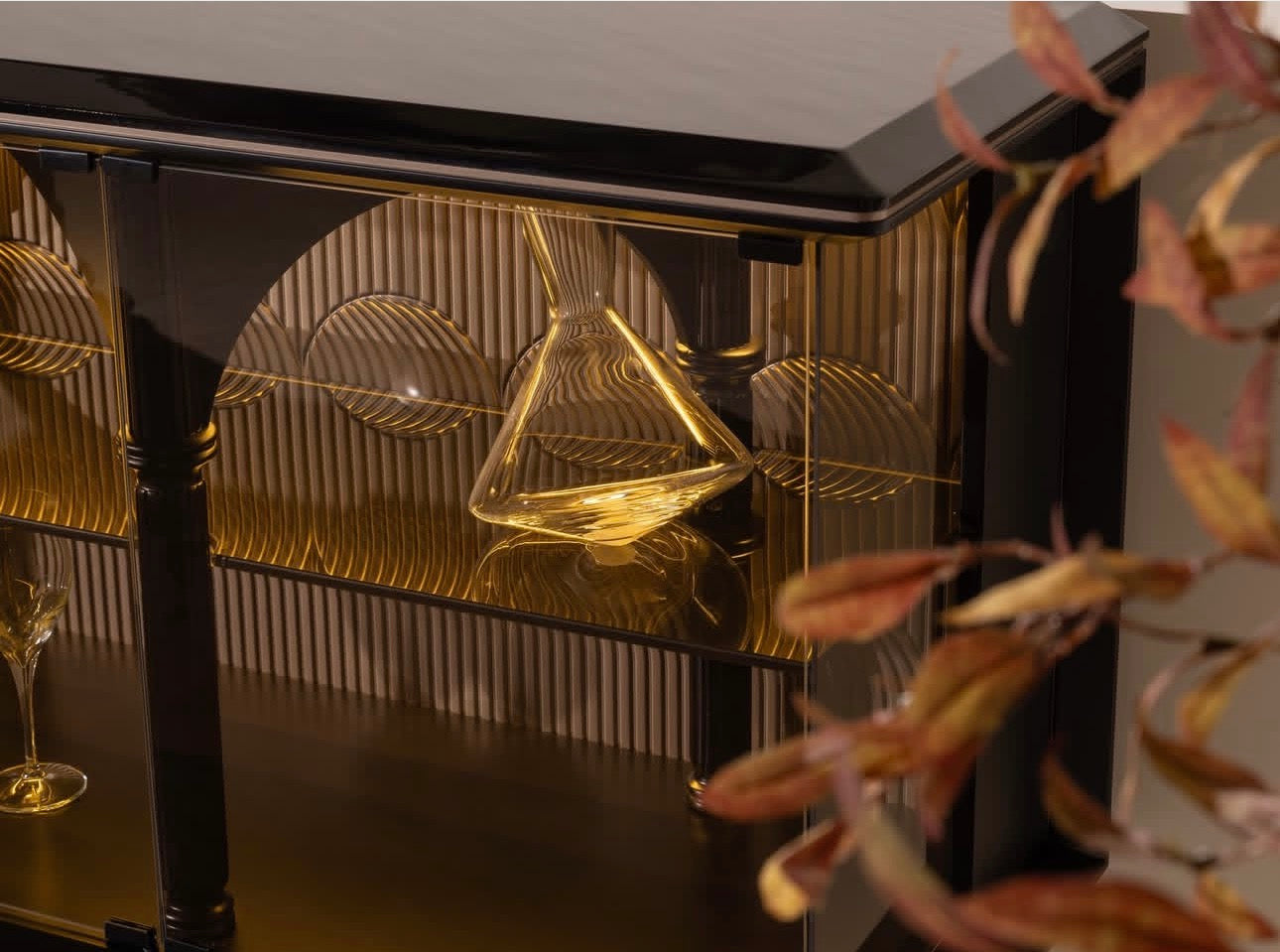 Velvetroom luxury furniture collection featuring elegant sofa seating, modern dining table, illuminated cabinetry, and sculptural pendant lighting.