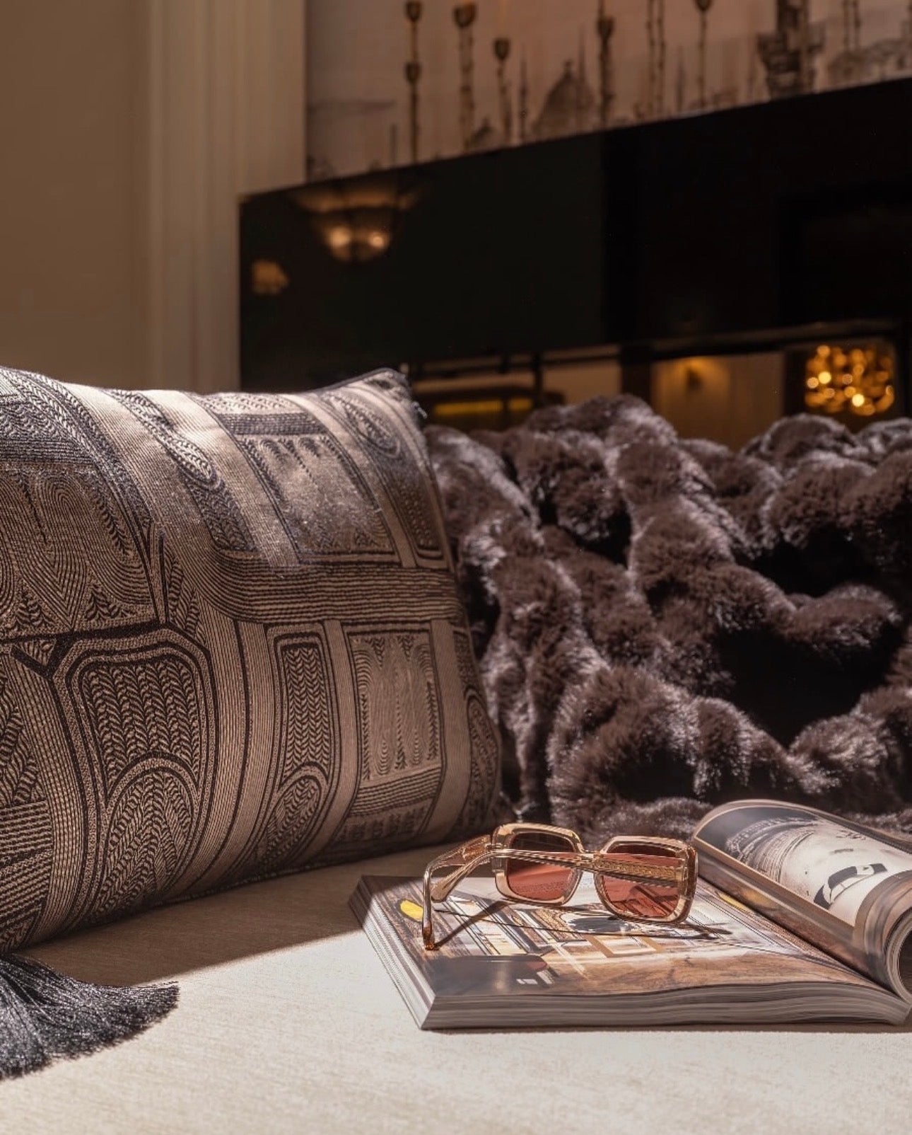 Velvetroom luxury furniture collection featuring elegant sofa seating, modern dining table, illuminated cabinetry, and sculptural pendant lighting.