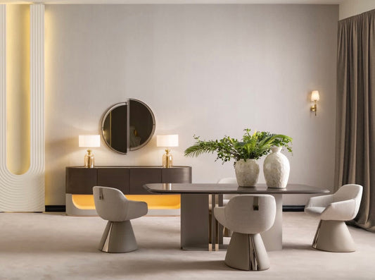 Modern luxury living room and dining set with curved sofas, sculptural chairs, and gold accent tables in neutral interior.