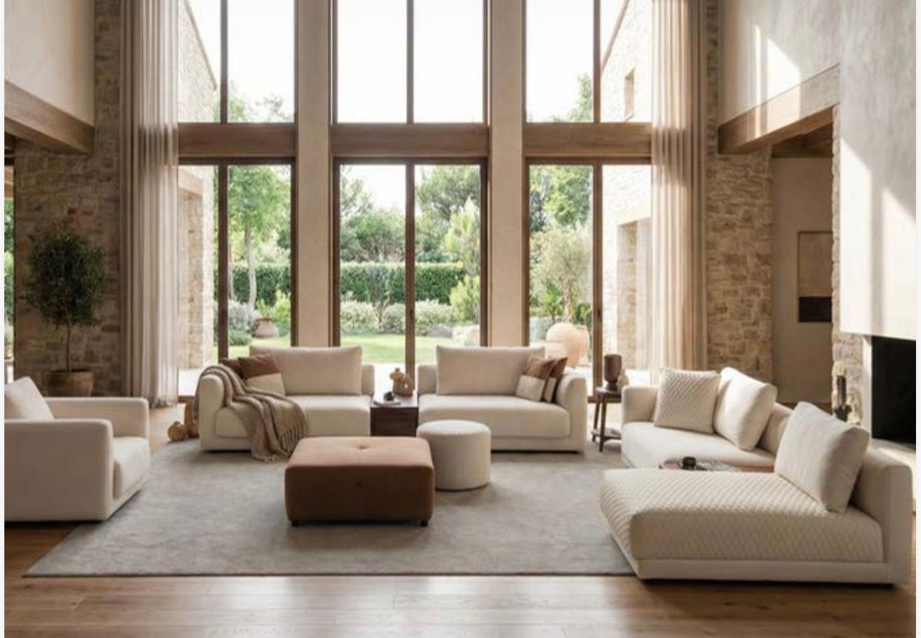 Prelude luxury furniture collection featuring modern sofa seating, elegant dining table with upholstered chairs, and contemporary neutral interior design.