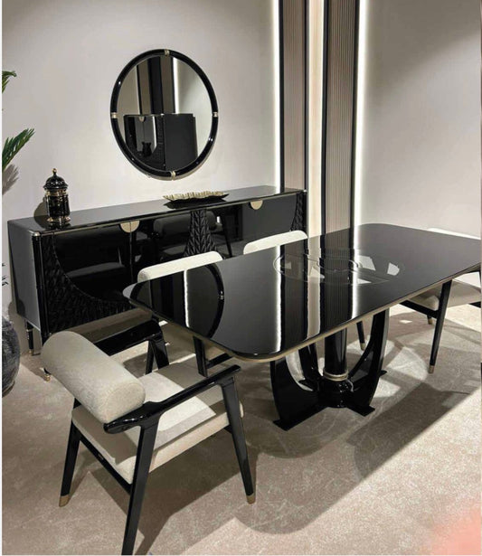Portrait luxury furniture collection featuring glossy black dining table, sculptural cabinet, and modern curved seating in a contemporary interior.