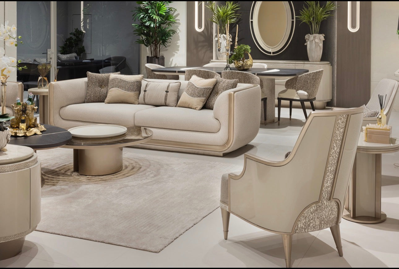 Prelude luxury furniture collection featuring modern sofa seating, elegant dining table with upholstered chairs, and contemporary neutral interior design.