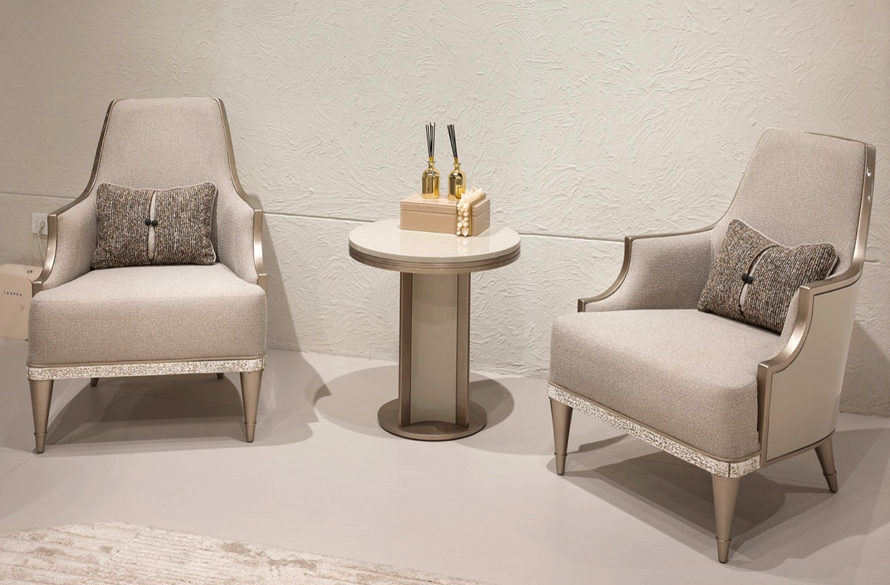 Prelude luxury furniture collection featuring modern sofa seating, elegant dining table with upholstered chairs, and contemporary neutral interior design.