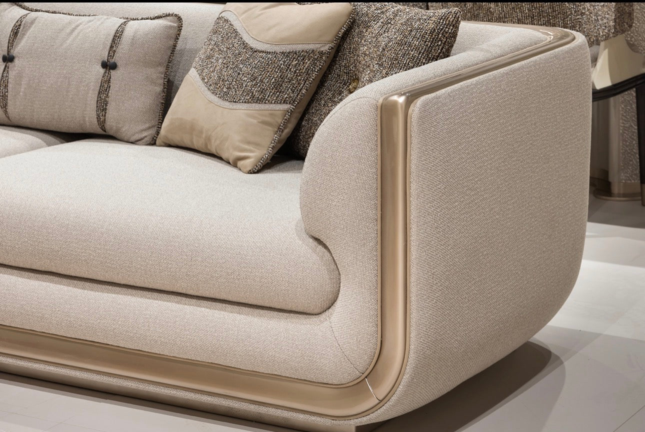 Prelude luxury furniture collection featuring modern sofa seating, elegant dining table with upholstered chairs, and contemporary neutral interior design.