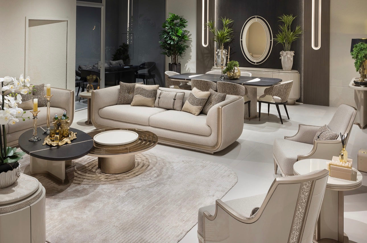 Prelude luxury furniture collection featuring modern sofa seating, elegant dining table with upholstered chairs, and contemporary neutral interior design.