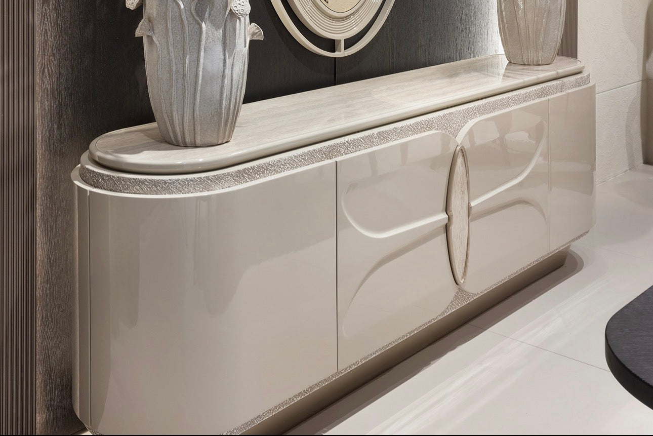 Prelude luxury furniture collection featuring modern sofa seating, elegant dining table with upholstered chairs, and contemporary neutral interior design.