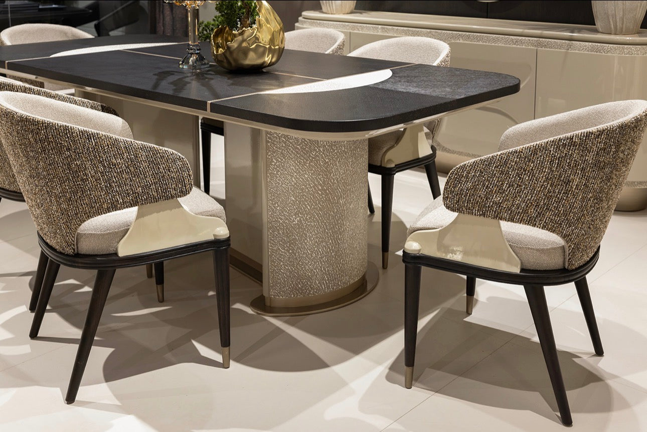 Prelude luxury furniture collection featuring modern sofa seating, elegant dining table with upholstered chairs, and contemporary neutral interior design.