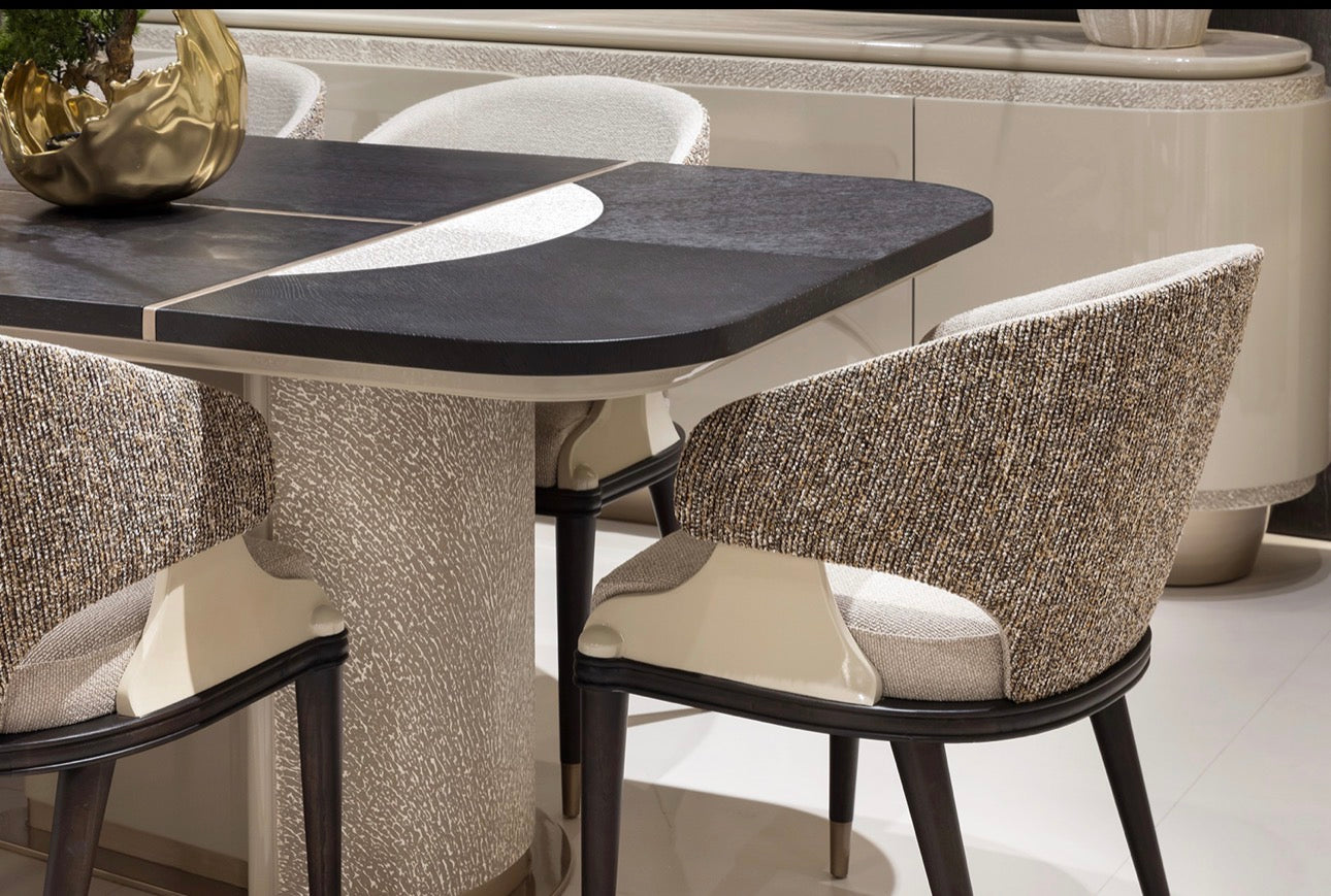 Prelude luxury furniture collection featuring modern sofa seating, elegant dining table with upholstered chairs, and contemporary neutral interior design.