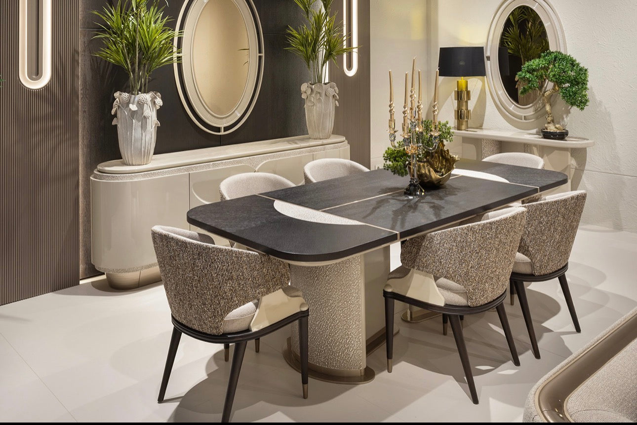Prelude luxury furniture collection featuring modern sofa seating, elegant dining table with upholstered chairs, and contemporary neutral interior design.