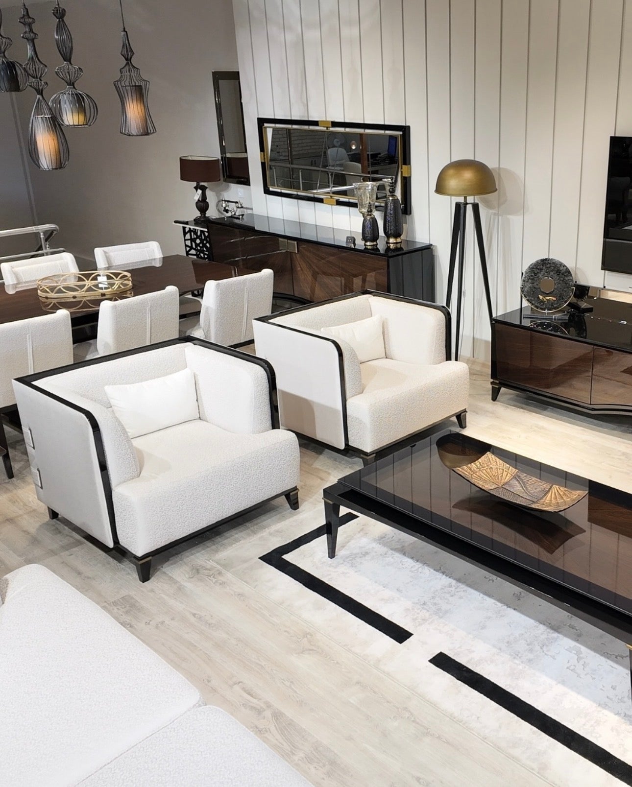 Smoke modern luxury furniture collection featuring neutral upholstery with dark accents in a contemporary interior setting.