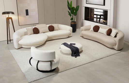 Hush curved sofa furniture collection featuring soft neutral lounge seating and sculptural modern living room design.