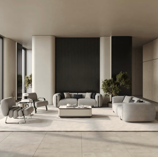 Facet modern luxury furniture collection with curved sectional seating, marble dining table, and sculptural lounge chairs.