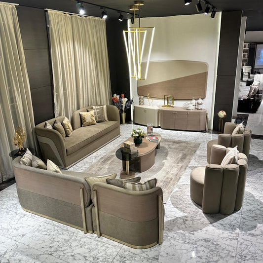 Sonata luxury furniture collection featuring curved modern sofas, sculptural accent chairs, and contemporary dining table in warm neutral tones.