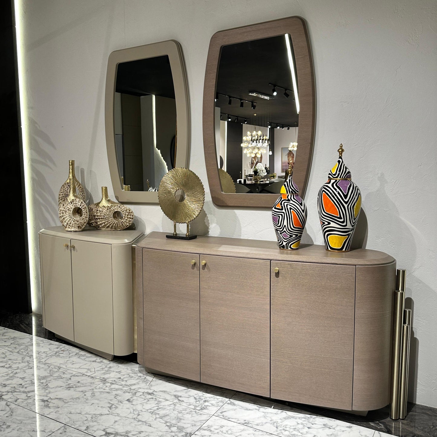 Sonata luxury furniture collection featuring curved modern sofas, sculptural accent chairs, and contemporary dining table in warm neutral tones.