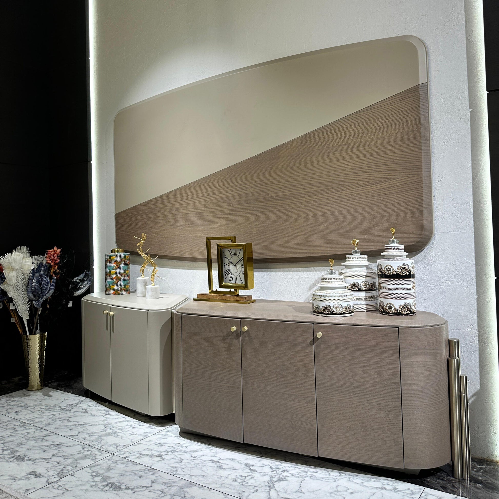 Sonata luxury furniture collection featuring curved modern sofas, sculptural accent chairs, and contemporary dining table in warm neutral tones.