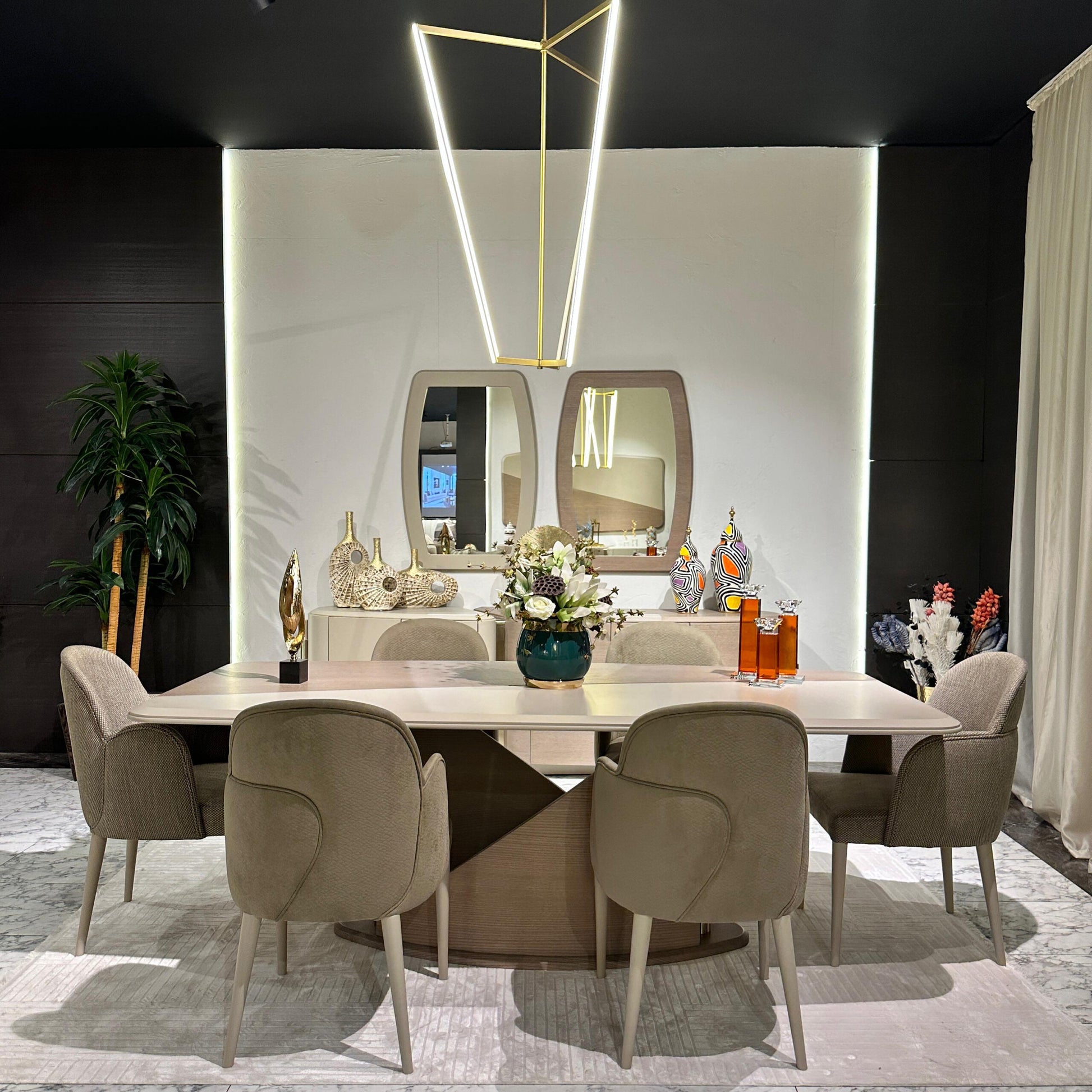 Sonata luxury furniture collection featuring curved modern sofas, sculptural accent chairs, and contemporary dining table in warm neutral tones.