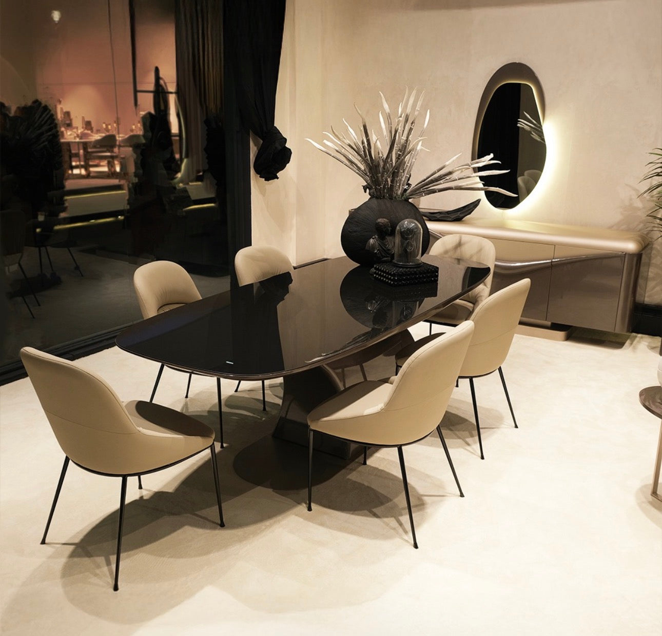 Regal luxury furniture collection featuring curved sofa seating, modern dining table with upholstered chairs, and contemporary living room design.