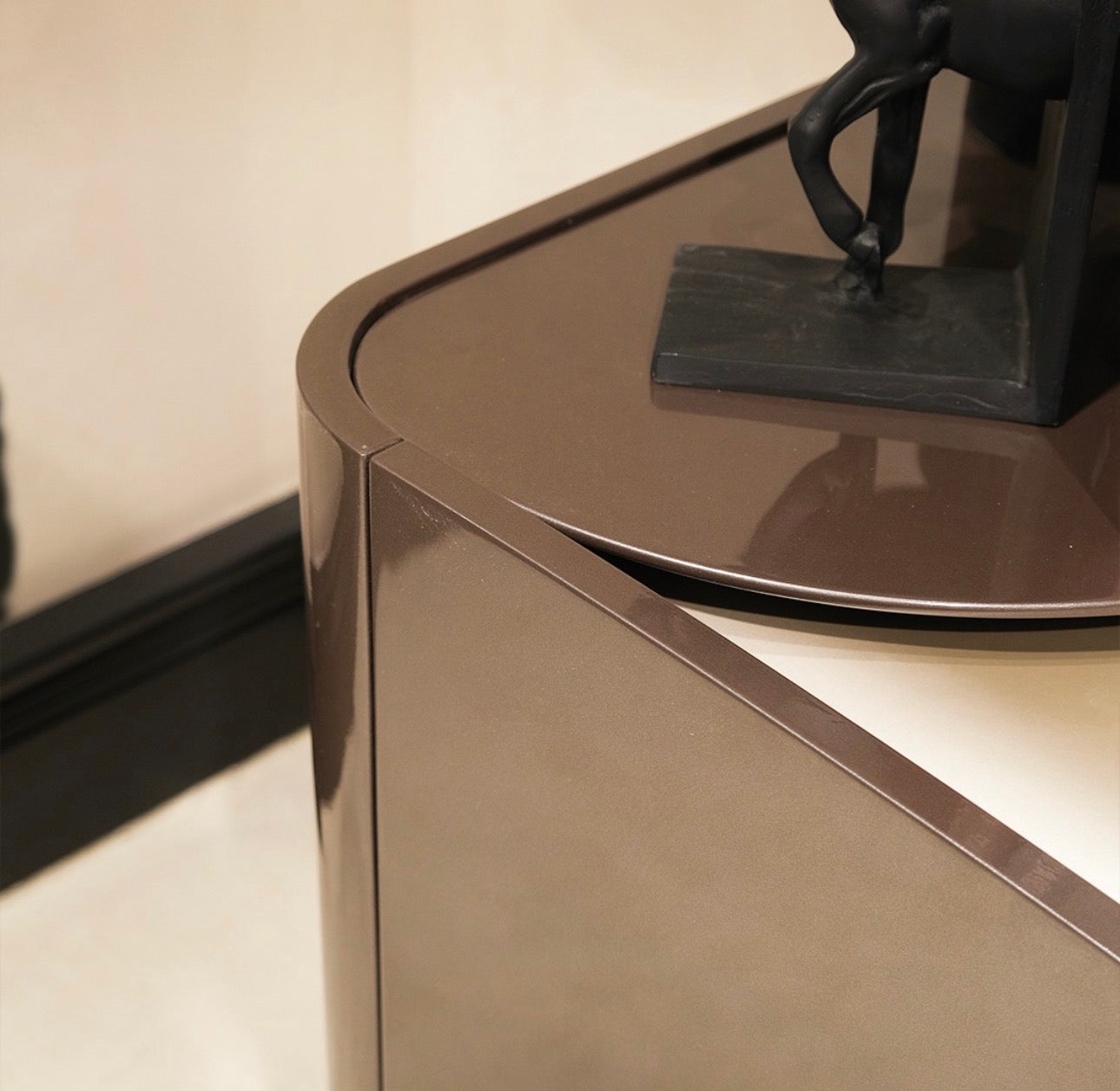 Regal luxury furniture collection featuring curved sofa seating, modern dining table with upholstered chairs, and contemporary living room design.