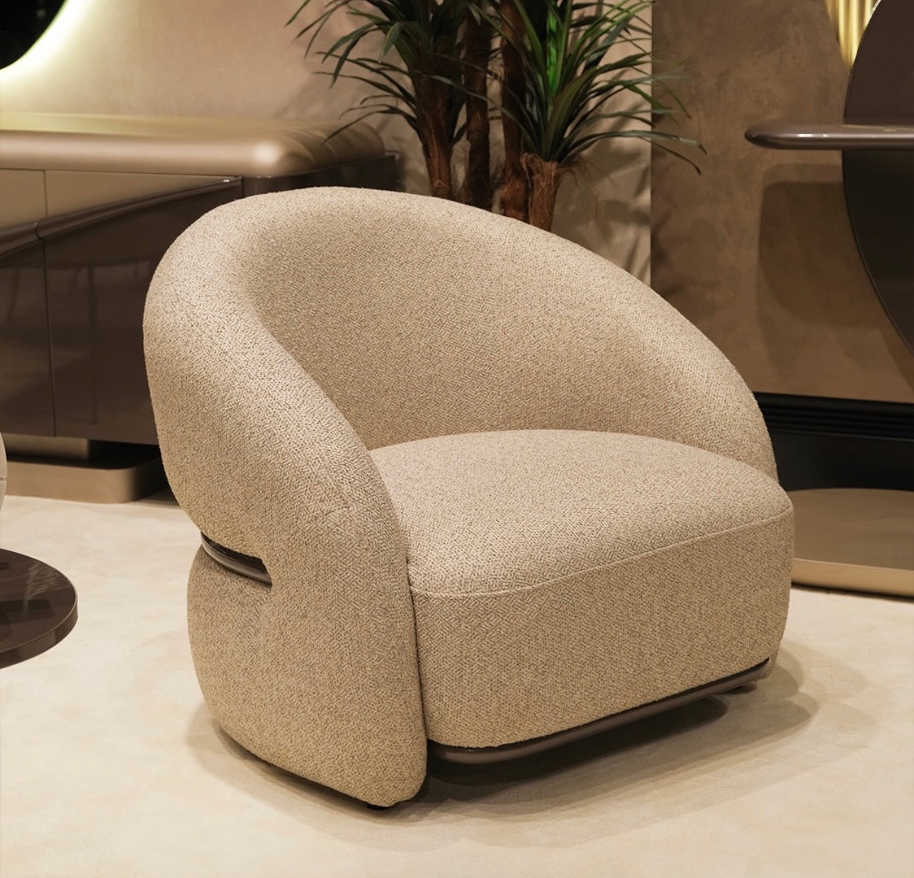 Regal luxury furniture collection featuring curved sofa seating, modern dining table with upholstered chairs, and contemporary living room design.