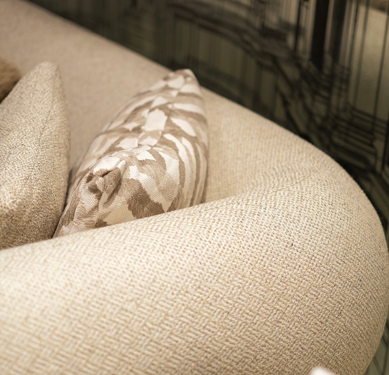 Regal luxury furniture collection featuring curved sofa seating, modern dining table with upholstered chairs, and contemporary living room design.