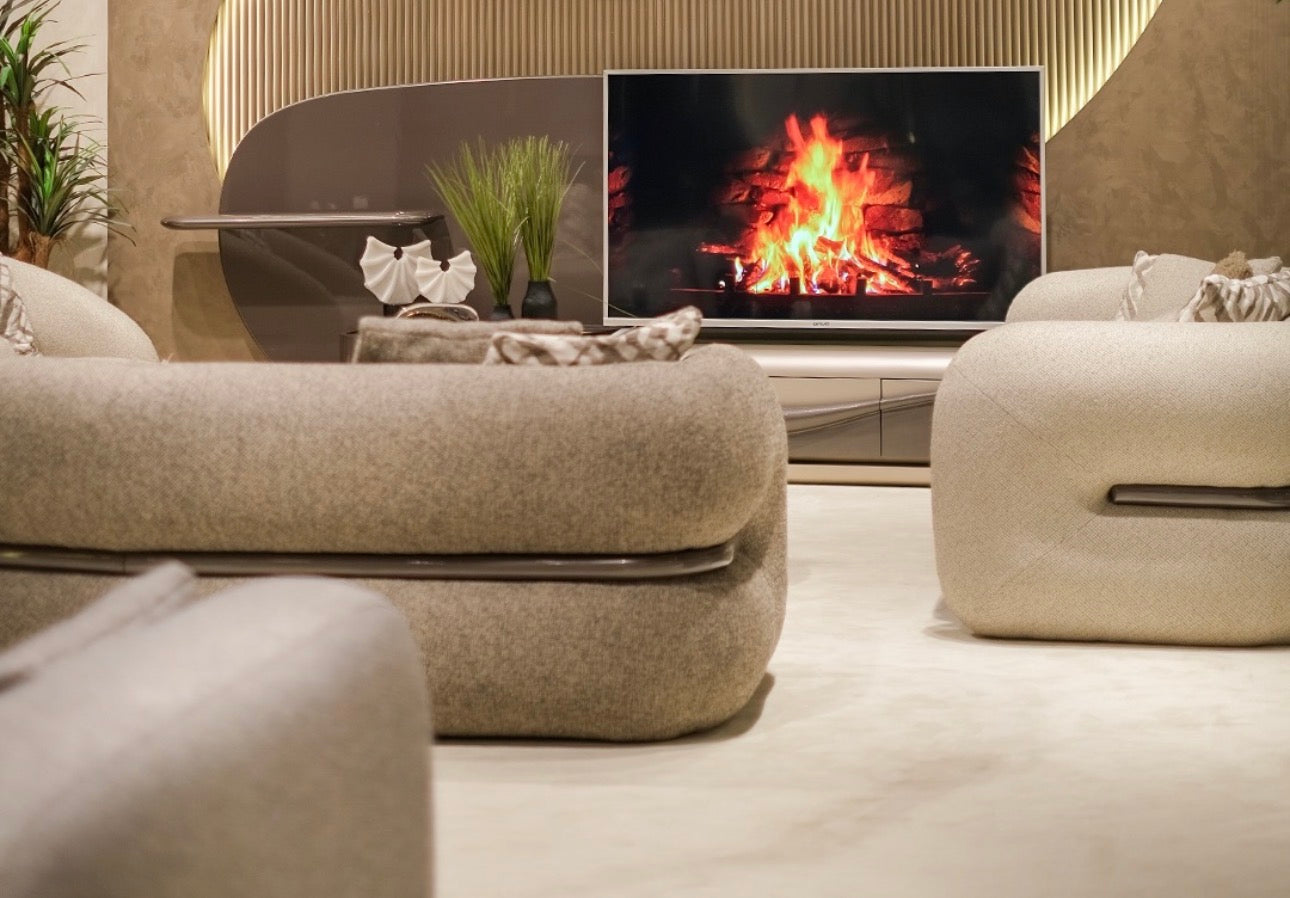 Regal luxury furniture collection featuring curved sofa seating, modern dining table with upholstered chairs, and contemporary living room design.